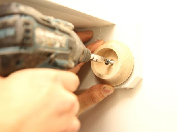 Attach right side bracket to the wall using a 2 inch wood screw. Repeat steps for Left side bracket.