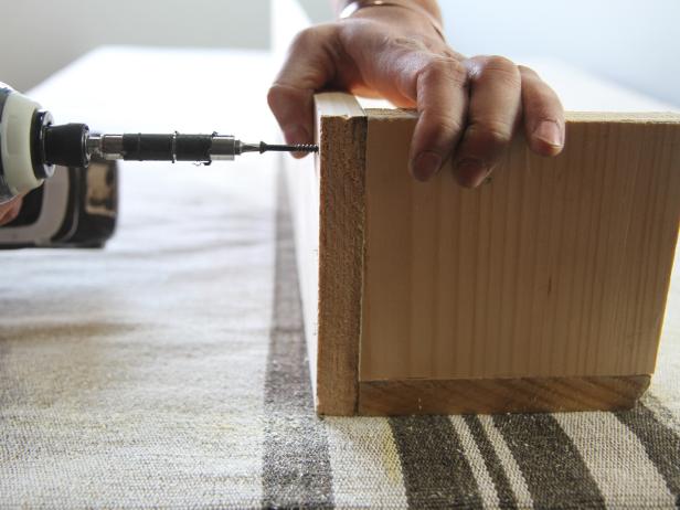 Coat the wood with foam and fabric spray adhesive.