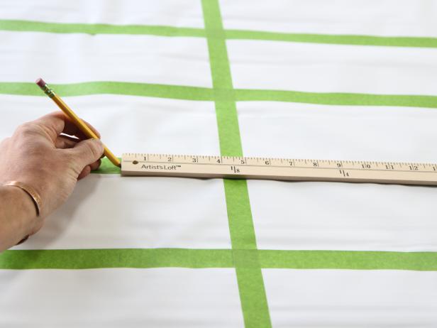 Measure 4â off of the vertical tape-line and repeat steps to create 4â X 4â cubes on the entire shade.