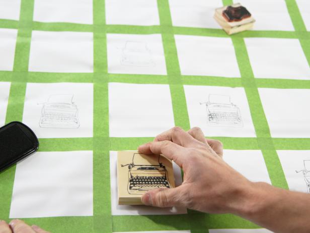 Stamp alternating squares on the shade with the first stamp, making sure to blot the stamp pad between each application.