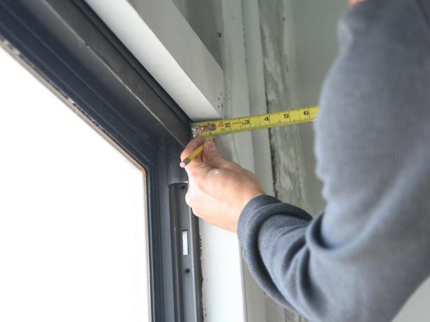 Measure and mark the center of the interior window frame.