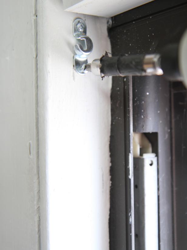 Repeat steps to secure the hardware on the opposite side of the window frame