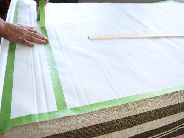 Starting on the right side at the 4â mark, keep the tape line as straight as possible, and run the entire horizontal width of the shade, ending on the 4â mark on the left side.