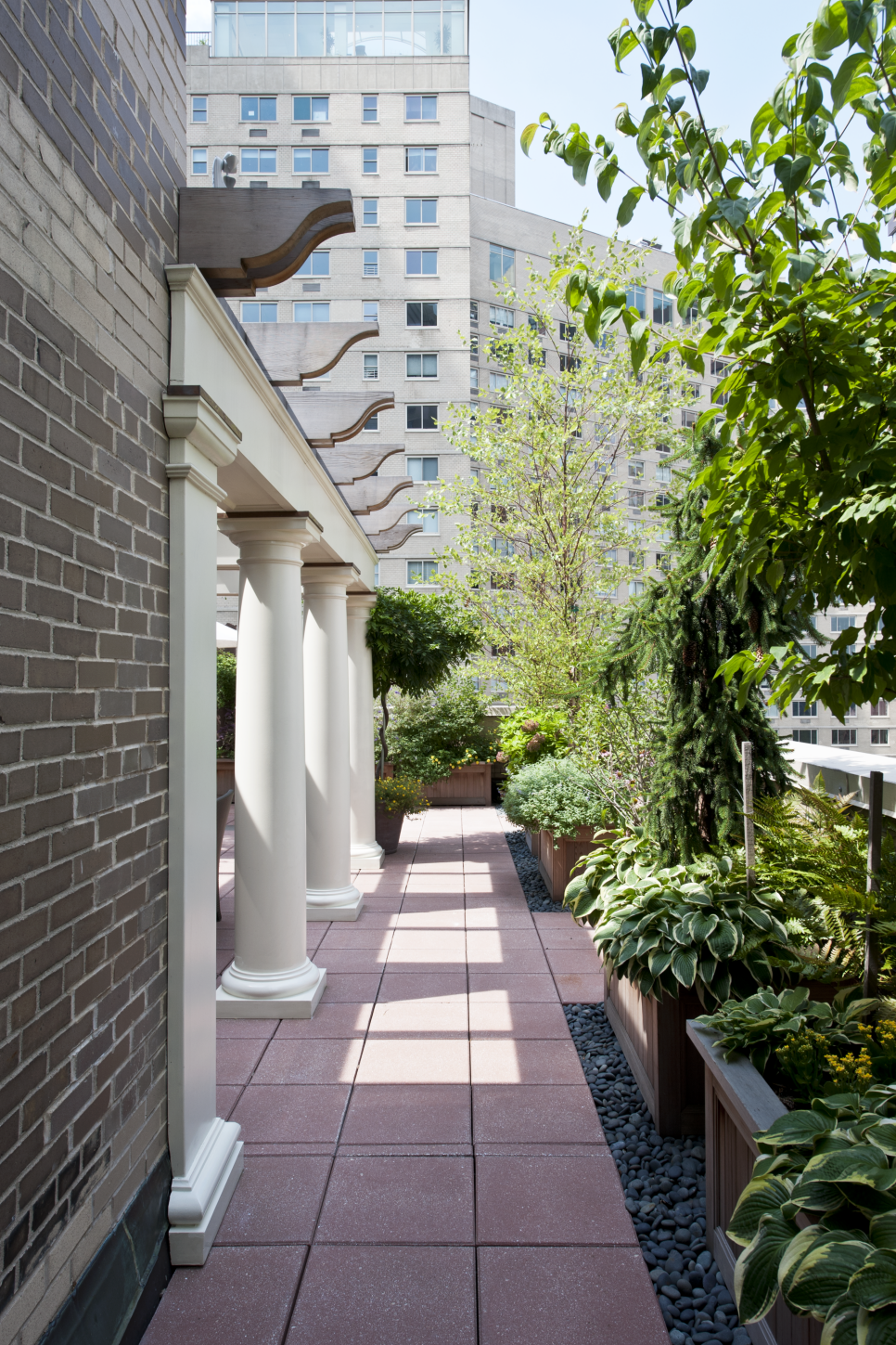 Serene, Contemporary Terrace With Lush Green Plants City Patio Space With Pillars & Plants