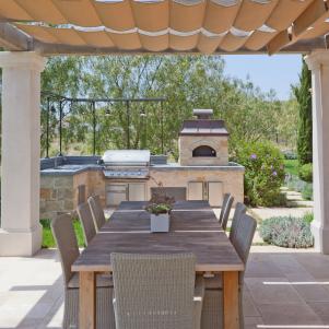 Outdoor Dining Room With Stone Kitchen, Wood-Fired Oven