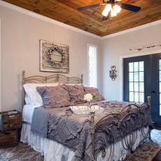 Rustic Master Bedroom With Leaded Glass Windows
