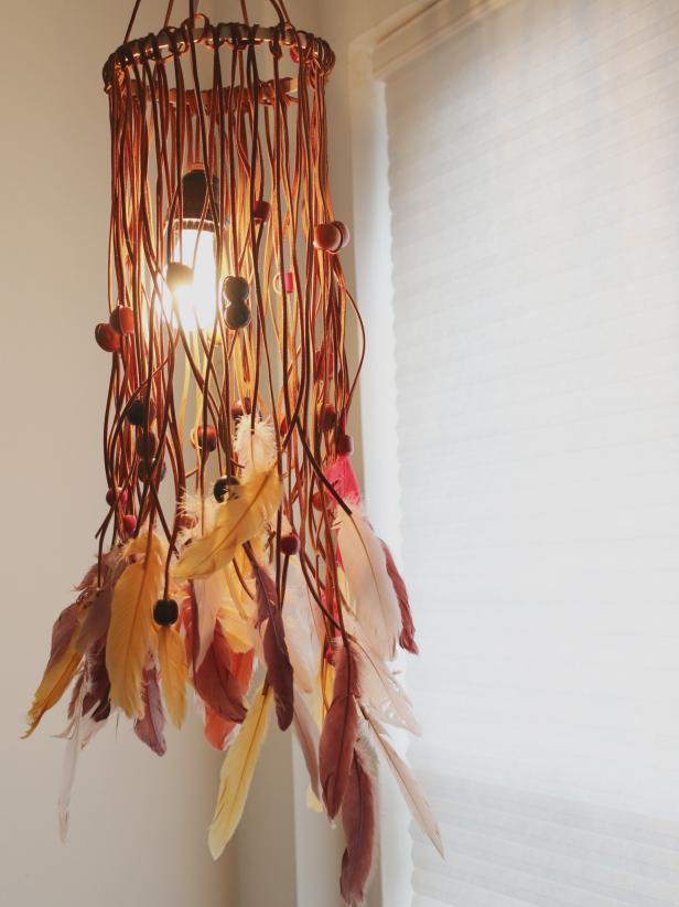 Your home will have that bohemian flair with this leather chandelier pendant light. Everyday art supplies are transformed into a feathered and beaded conversation piece to accent your favorite room.