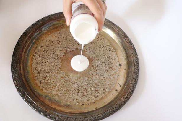 Pour a small pile of mod podge in the center of the tray. Brush it around to fully cover the bottom inside of the tray.
