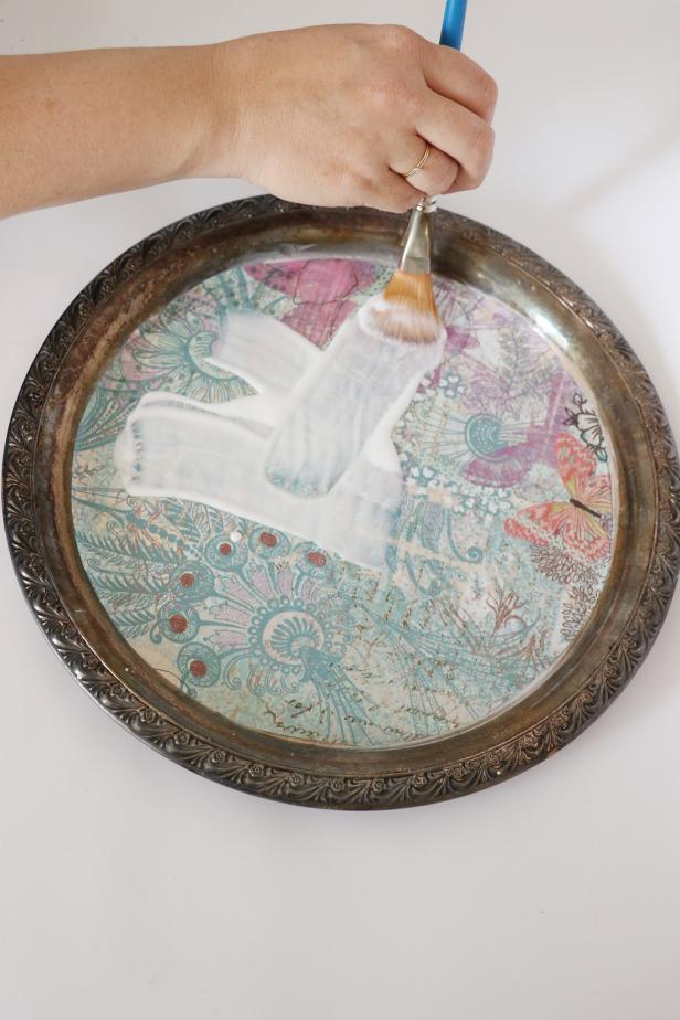 Pour another small pile of mod podge on top of the paper. Brush it into an even and smooth layer over the paper. Let dry.