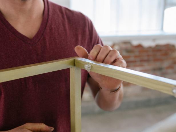 Insert shelf support pegs and double check that the mirror sits exactly how you want it before moving on.