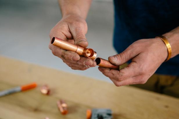 Dry fit copper piping to make a one-of-a-kind candelabra.