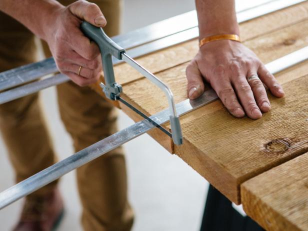 Cut two of the 8’ aluminum flat bars in half using a hack saw to create four 4’ pieces.