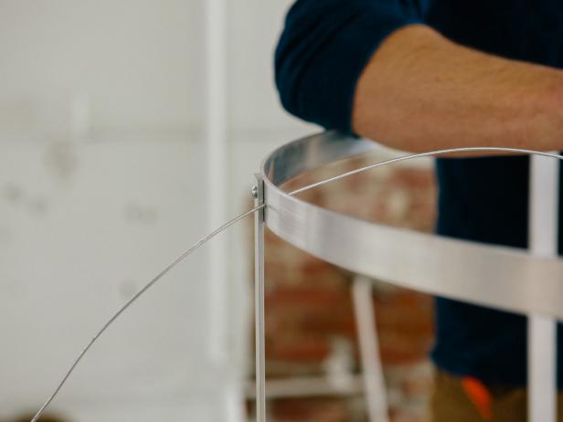 Loop wire through lamp base to make a pendant light.