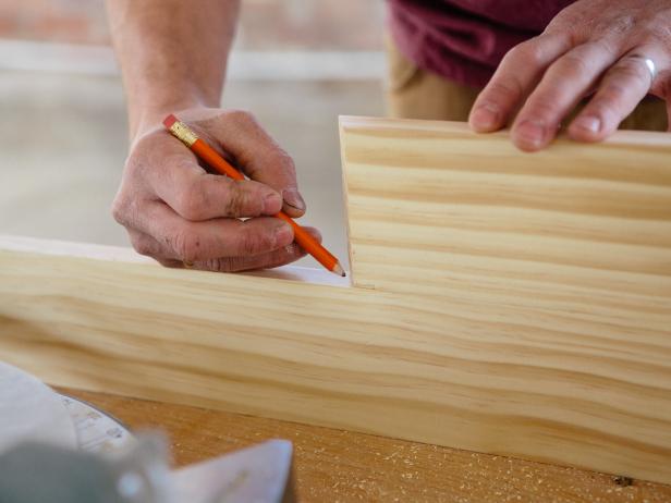 Measure the length you want the sides of the triangle shelf, and mark with a pencil.