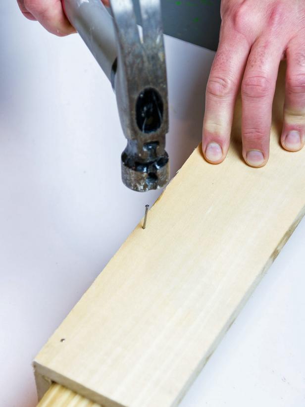 Add a bead of wood glue to the narrow edge of one of the boards. Press it against the flat side of the other board making an ‘L’ shape. Secure with at least 5 finishing nails through the flat side and into the narrow edge. Sink nail heads slightly with a nail set. There is no need to fill these nail holes as this will be the back of the shelf.