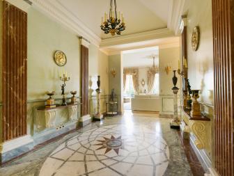 Beautifully Decorative Victorian Hallway in Paris With Artistic Marble Flooring and Accent Wall Columns  