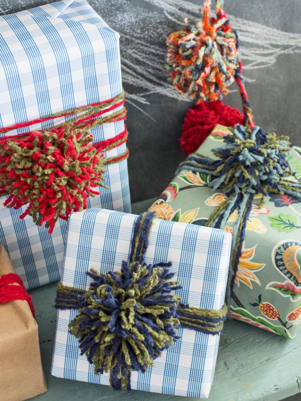 Kids love seeing their handmade pom-pom used at Christmas. This colorful yarn garland is fun and simple to make for kids of all ages, making it an ideal family craft.