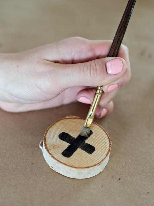 Also, use stain and brushes to draw x's and o's onto wood slices. Since those are &quot;end grain&quot;, they do not need to be cut prior to painting with stain.