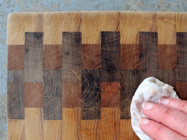 Use a damp rag to remove sanding dust so you can see where you need to continue sanding.
