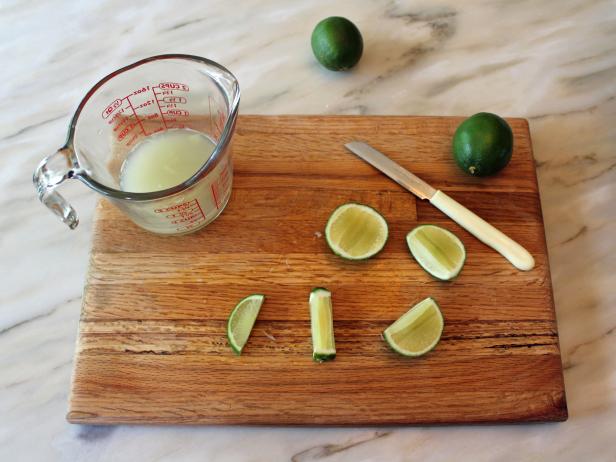 Fresh Limes on a Cutting Board Fresh Limes on a Cutting Board