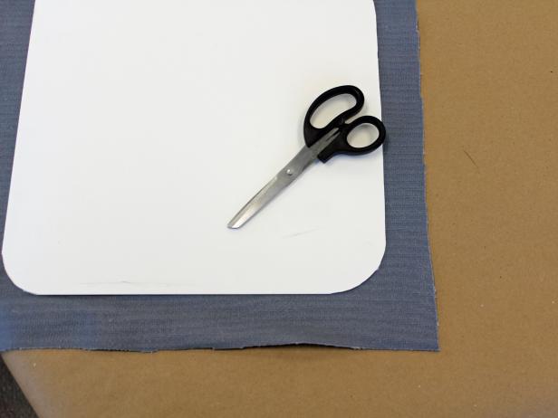Cut fabric for tray liner just a bit larger than the insert.