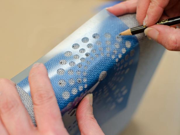 Use a stencil and pencil to mark pattern on side of tray.