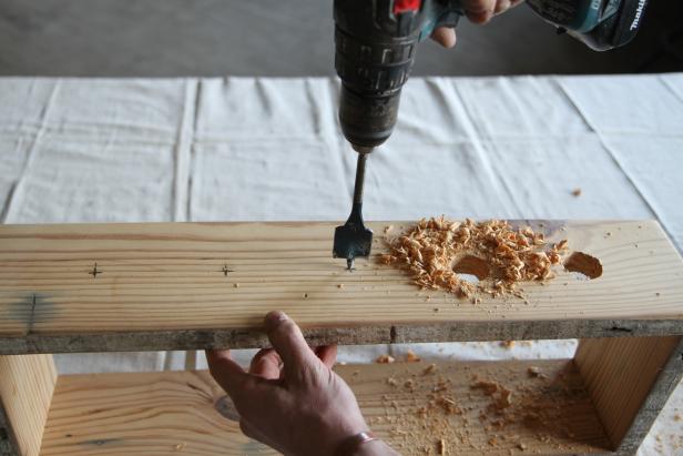 Drill holes at marks using a paddle bit to make a bottle centerpiece.