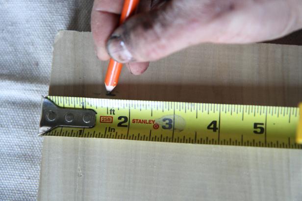 Measure and mark at 1 1/2" from each side of one of the corners of the wood piece.
