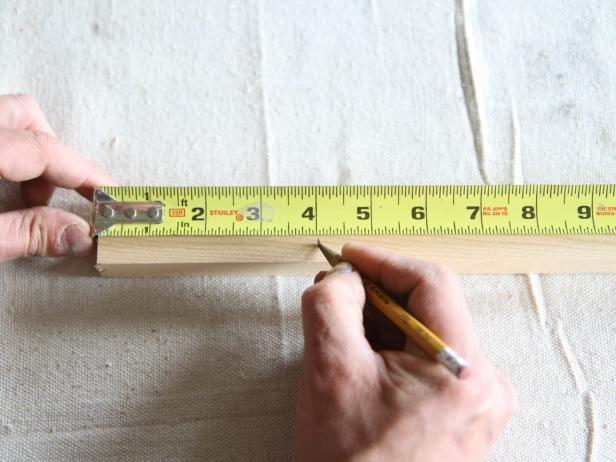 Measure wood dowel at 4" from each end, and mark before drilling holes.