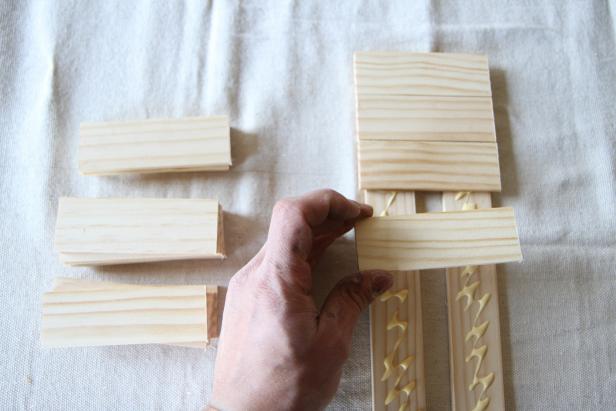 Attach 4-inch paint sticks to full-length paint sticks.