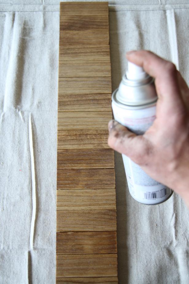 Spray entire piece with a coat of clear satin polyurethane.