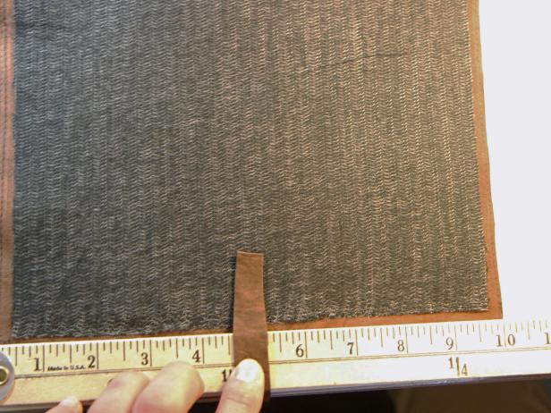 Place leather strip in the middle of the leather case.