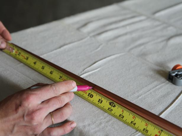 Measure and mark 1/2-inch copper pipe at 10" using a permanent marker.