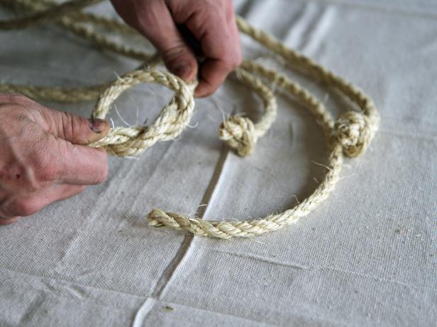 Tie a knot at the end of each rope to make a hanging planter.