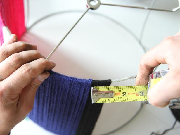 Wrap one inch of the fourth yarn color around the lampshade.