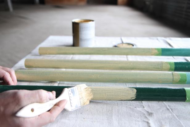 Apply gold paint to the bottom of the poles to create a color-block effect.