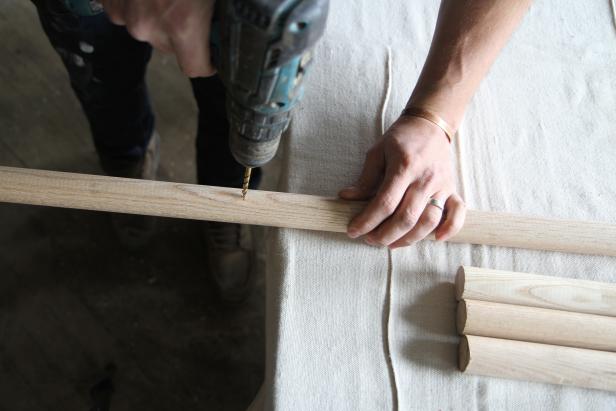 Drill holes in the closet poles at the 18-inch mark.
