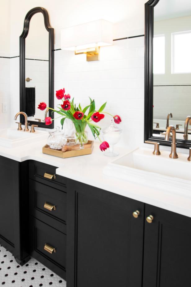 Bathroom with White Counters and Black Wood Vanity