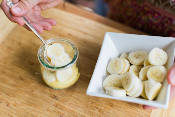 In a small glass jar, add 1/8 cup cookie crumbs (Image 1), then 1 tsp toasted coconut (Image 2), 1/3 cup pudding mixture (Image 3), 4-5 slices of banana (Image 4) and ¼ cup whipped cream (Image 5). Repeat until pudding or whipped cream reaches just below the rim of the jar (Image 6).