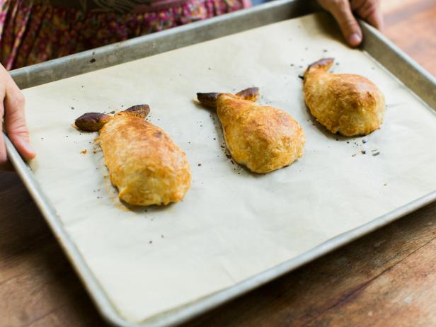 Prick dough all over with a knife or fork, then brush pears with milk. Bake at 400 degrees for 15-20 minutes or until golden brown