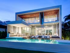 This modern home by STRANG Architecture epitomizes Miami living. The house features a cool, minimalist aesthetic, an interior courtyard, ocean views and is full of natural light thanks to large windows throughout.