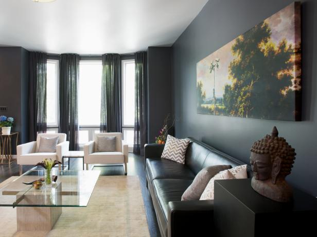 Modern Gray Living Room with Bay Windows and Colorful Art Modern Gray Living Room with Bay Windows and Colorful Art