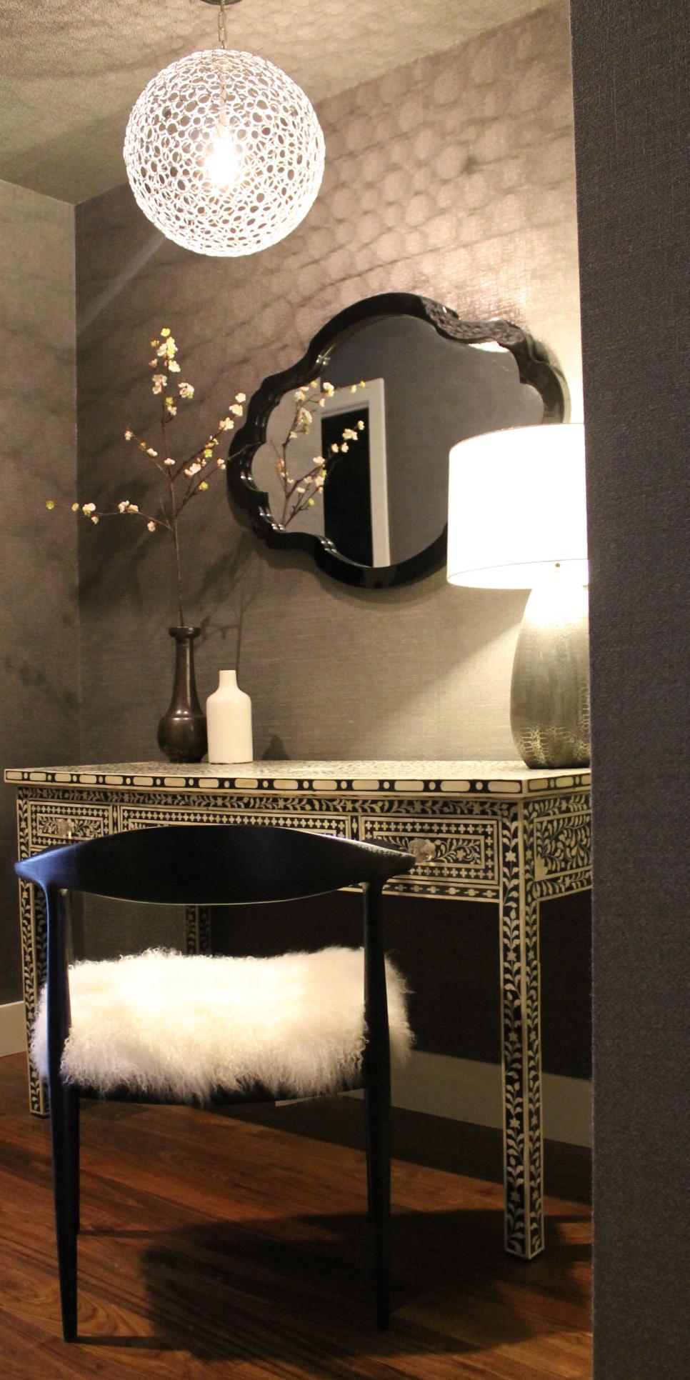 Modern Dressing Area with Globe Light Hanging Fixture, Inlaid Wood Table and Flokati Cushion Black and White Dressing Table