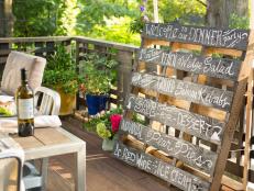 Add a little sophistication to your next dinner party with this chalkboard menu board upcycled from an old wood pallet.