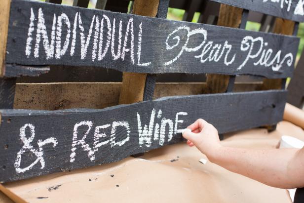 Add a little sophistication to your next dinner party with this chalkboard menu board upcycled from a wooden pallet.