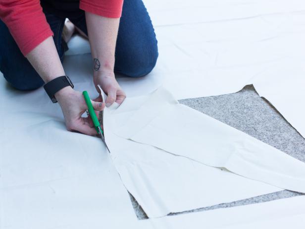 Draw 5 randomly spaced 18” squares onto the drop cloth, then cut out each square.