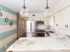 Beachy Kitchen With Striped Accent Wall