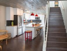 Lucy and Daphne transformed this kitchen space into a modern red-and-gray masterpiece with rustic and industrial design elements. See our favorite details from the space, and see all the before-and-after photos. 