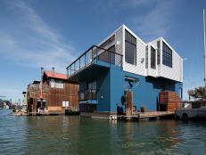 Modern Floating Home With White & Blue Metal Siding