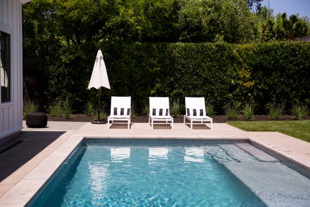 Backyard Pool With White Lounge Chairs Backyard Pool With White Lounge Chairs